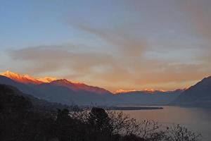 a view of a lake with mountains in the background at Casa Leula 2 1 2 Zimmerwohnung in Ronco s/Ascona - Porto Ronco +2 photos