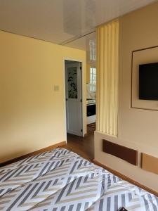 Postel nebo postele na pokoji v ubytování Cabaña vista Picachos de Olá Cerca a ríos y cascadas