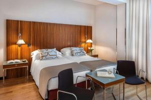 Ένα ή περισσότερα κρεβάτια σε δωμάτιο στο Starhotels Anderson +66 φωτογραφίες