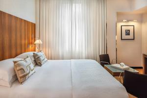 Ένα ή περισσότερα κρεβάτια σε δωμάτιο στο Starhotels Anderson