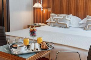 Ένα ή περισσότερα κρεβάτια σε δωμάτιο στο Starhotels Anderson