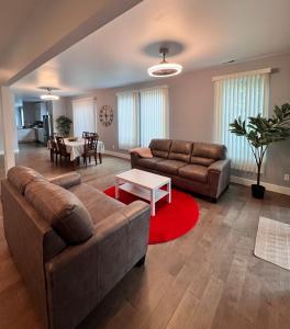a living room with a couch and a table at Cozy and stylish 3BR house in Tacoma