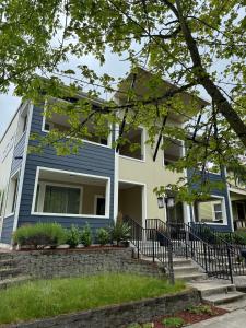 a home with a blue and white house at Cozy and stylish 3BR house in Tacoma +17 photos