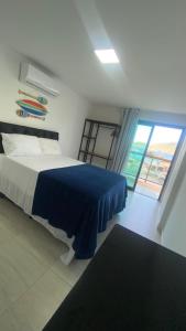 Postel nebo postele na pokoji v ubytování Apartamento em Resort frente ao Mar + 46 fotografií