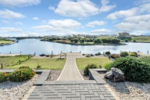 a walkway leading to a lake in a park at Isla Bonita - Pet Friendly - Not Fully Fenced - No Linen Included in Hindmarsh Island