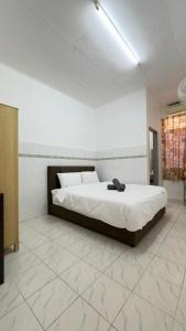 En eller flere senge i et værelse på Senawang Matahari height Best Location + 8 billeder