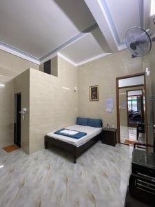 a large room with a bed in the middle of it at Thiên Tân Motel 2 in Quang Ngai