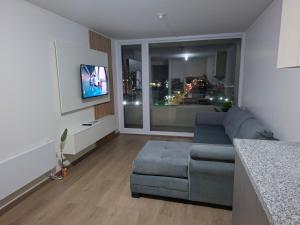 TV a/nebo společenská místnost v ubytování Apart Liucura Edificio Belmonte Temuco