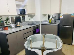 Kuchyň nebo kuchyňský kout v ubytování Apart Liucura Edificio Belmonte Temuco