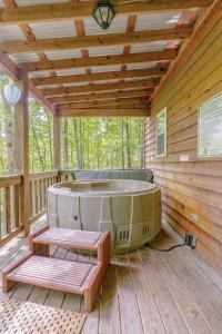 a sauna on a wooden deck with a soaking tub at Rustic Cabin on 28-Acre Property in the Foothills of the Blue Ridge Mountains in Elkin