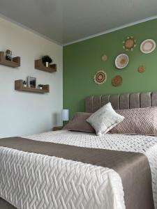 Postel nebo postele na pokoji v ubytování Casa de descanso en el corazón de Salento, Quindío