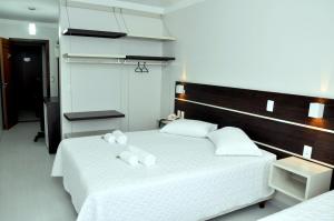 A bed or beds in a room at Hotel Villa Cerrado