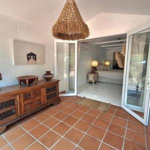 a room with a room with a mirror and a table at Studio Casablanca in Nelly Bay +3 photos