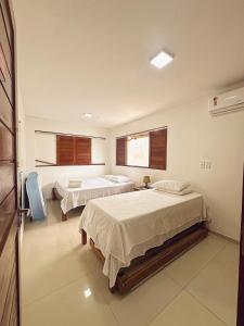 Postel nebo postele na pokoji v ubytování Casa Praia Pontal do Coruripe + 41 fotografií