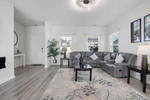 a living room with a couch and a table at The Beautiful 31 in Port Wentworth
