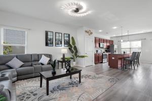 a living room with a couch and a table at The Beautiful 31 in Port Wentworth