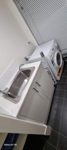 Kuchyň nebo kuchyňský kout v ubytování Modern Comfort + 7 fotografií