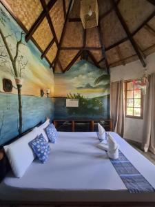 Postel nebo postele na pokoji v ubytování Kokosnuss Garden Resort + 88 fotografií