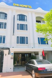 a car parked in front of a building at Gia Hưng Khang Hometel in Ha Long