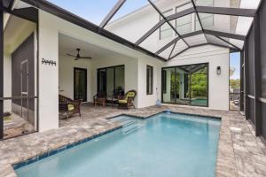 a swimming pool in a house with a patio at 140 Ocean Estates Dr in Lakewood Park