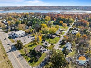 an aerial view of a subdivision with trees and a lake at Lake Geneva Family House Pool Table Fireplace and Sleeps 10 in Lake Como