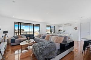 a living room with a couch and a table at 32 Hargreaves-Linen Included-Pets Negotiable-Wi-Fi in Middleton