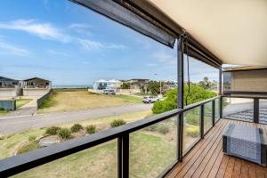 a balcony with a view of the ocean at 32 Hargreaves-Linen Included-Pets Negotiable-Wi-Fi in Middleton