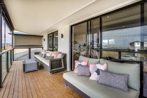 a living room with a couch and a balcony at 32 Hargreaves-Linen Included-Pets Negotiable-Wi-Fi in Middleton