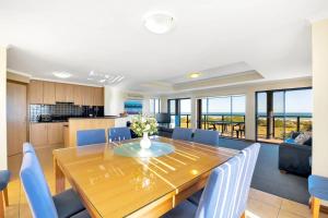 a dining room and kitchen with a table and chairs at Coast View - 39b Hargreaves - Family - Beach - No Linen Included in Middleton
