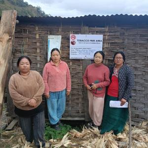 a group of women standing in front of a building at The kamcha Homestay in Bomdila