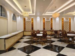 a meeting room with a table and chairs at B Dot in Gaushala