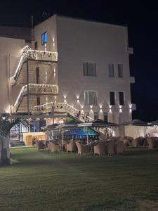 a group of chairs in front of a building at night at B Dot in Gaushala