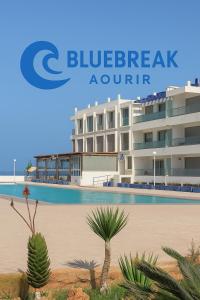 a rendering of a building with a swimming pool at BlueBreak Aourir in Aourir