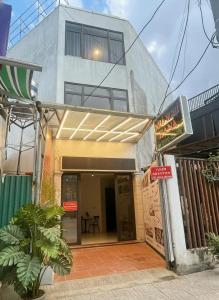 a building with awnings on the front of it at Hana House in Kỳ Lừa