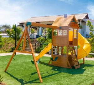 a playground with a slide and a house at Cozy House! San Miguel in San Miguel