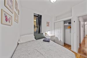 a bedroom with a large bed and a desk at Private Room at a Shared Apartment by Times Square Manhattan in New York +1 photo