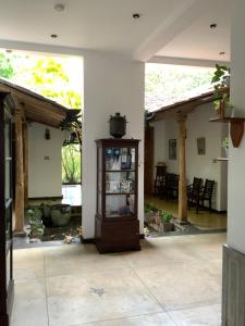 a living room with a cabinet in the middle at Lali Villa in Galle +32 photos
