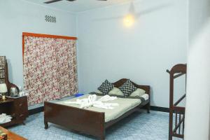 Postel nebo postele na pokoji v ubytování Noor Aman Guest House