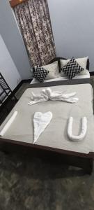 Postel nebo postele na pokoji v ubytování Noor Aman Guest House