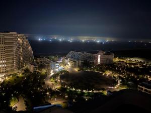 a view of a city at night with lights at Cam Ranh Resort in Cam Ranh