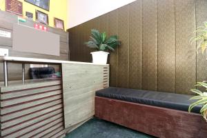a waiting room with a bench in a store at Hotel O Star INN in Jalandhar