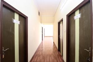 a corridor of an empty room with doors at Hotel O Star INN in Jalandhar