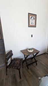 a table and a chair in a room with a table at Casa Ñogi 