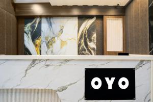 a shelf with an ovo sign on it at Hotel O Shree Vishwanath in Varanasi