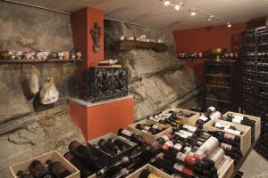 a room filled with lots of bottles of wine at Boutique Hotel Albergo Brione in Locarno