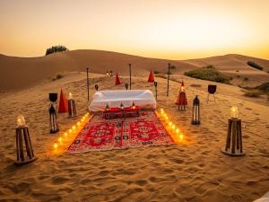 a tent in the desert with lights in the sand at The Majestic Heaven Resort in Sām +21 photos