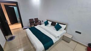 Ένα ή περισσότερα κρεβάτια σε δωμάτιο στο Hotel O Sukoon Guest House