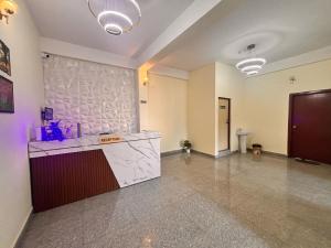 an empty room with a counter in a building at Collection O Arya Vidyapeeth College Guwahati in Guwahati