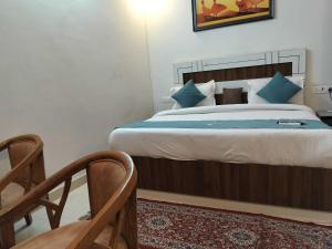 Postel nebo postele na pokoji v ubytování Collection O Uttaranchal University Premnagar