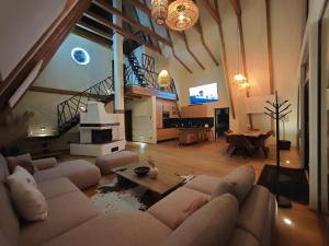 a living room with a couch and a table at Chalet Rafenstein in Moisei